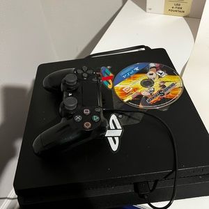 PS4 Slim with controller and game